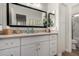 Bathroom vanity with white cabinetry and an oversized mirror at 3431 E Canary Ct, Chandler, AZ 85286