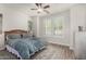 Bright bedroom featuring a ceiling fan and shuttered windows at 3431 E Canary Ct, Chandler, AZ 85286