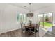 Cozy dining area with a round table, stylish chandelier, and natural light at 3431 E Canary Ct, Chandler, AZ 85286