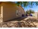 Exterior side view shows desert landscaping and access to the backyard at 3431 E Canary Ct, Chandler, AZ 85286