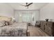 Bright main bedroom with bay window, wood floors, and comfortable furniture arrangement at 3431 E Canary Ct, Chandler, AZ 85286