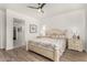 Spacious main bedroom featuring neutral decor, wood floors, and ample natural light at 3431 E Canary Ct, Chandler, AZ 85286