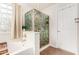 Well-lit bathroom featuring a soaking tub, a decorative shower with glass enclosure, and a classic tiled floor at 3603 S Weaver Cir, Gilbert, AZ 85297