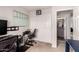 View of the bedroom featuring a closet with doors, an adjacent bathroom, and a weekly whiteboard calendar at 3603 S Weaver Cir, Gilbert, AZ 85297