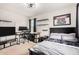 This inviting bedroom features ample lighting, a modern desk, and comfortable decor for a restful retreat at 3603 S Weaver Cir, Gilbert, AZ 85297