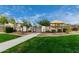 Gated entrance to the neighborhood pool features lush green grass and mature landscaping at 3603 S Weaver E Cir, Gilbert, AZ 85297