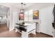 Bright dining area with a wooden table and bench seating, adjacent to the kitchen at 3603 S Weaver Cir, Gilbert, AZ 85297