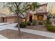 Charming two-story home showcasing manicured landscaping, a spacious driveway, and unique architectural details at 3603 S Weaver E Cir, Gilbert, AZ 85297