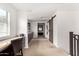 This hallway boasts built-in cabinets with countertops, a desk, and sliding barn door at 3603 S Weaver E Cir, Gilbert, AZ 85297