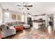 Open floor plan with living area flowing into a modern kitchen with granite countertops at 3603 S Weaver Cir, Gilbert, AZ 85297