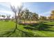 Scenic park view with lush green lawn, mature trees, and picnic areas perfect for relaxation at 3603 S Weaver E Cir, Gilbert, AZ 85297