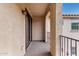 This is an exterior patio with textured walls, a railing, and a partially covered area at 3603 S Weaver Cir, Gilbert, AZ 85297