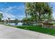 Scenic pond view with trees and landscaping, offering a serene outdoor space at 3603 S Weaver Cir, Gilbert, AZ 85297