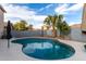 A backyard pool with mature landscaping offers a serene retreat for relaxation and enjoyment at 3603 S Weaver Cir, Gilbert, AZ 85297