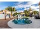 Backyard pool with lounge area and tropical landscaping for a private retreat at 3603 S Weaver E Cir, Gilbert, AZ 85297