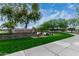 Well-manicured sign for Ranch House Clubhouse and Park, near a pond and green spaces at 3603 S Weaver E Cir, Gilbert, AZ 85297