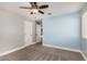 Bedroom featuring neutral tones, a ceiling fan, and a large window for natural light at 36076 N Vidlak Dr, San Tan Valley, AZ 85143