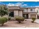 Charming two-story home with well-maintained desert landscaping and a tile roof at 36076 N Vidlak Dr, San Tan Valley, AZ 85143