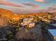 Wide aerial view of desert home with custom tile roof and beautiful sunset at 36430 N 34Th Ave, Phoenix, AZ 85086