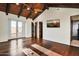 Bedroom featuring wood flooring, vaulted ceiling with beams, and French doors at 36430 N 34Th Ave, Phoenix, AZ 85086