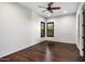 Bedroom featuring hardwood floors, a ceiling fan, and shuttered windows at 36430 N 34Th Ave, Phoenix, AZ 85086