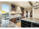 Modern kitchen featuring granite countertops, an island, and stainless steel appliances at 36430 N 34Th Ave, Phoenix, AZ 85086