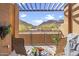 Relaxing covered balcony with seating and a view of the desert mountains at 36600 N Cave Creek Rd # D11, Cave Creek, AZ 85331