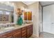 Bathroom featuring dual vanities with granite countertops and a neutral color palette at 36600 N Cave Creek Rd # D11, Cave Creek, AZ 85331