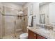 Elegant bathroom featuring granite counter, glass shower with decorative tile, and tasteful neutral color scheme at 36600 N Cave Creek Rd # D11, Cave Creek, AZ 85331