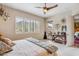 Bedroom featuring a ceiling fan, shutters and balcony access with views at 36600 N Cave Creek Rd # D11, Cave Creek, AZ 85331