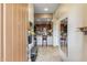 Inviting entryway with tiled floors leading to the kitchen with bar seating at 36600 N Cave Creek Rd # D11, Cave Creek, AZ 85331