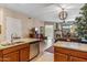 Open concept kitchen with island that flows into the living room with fireplace and views at 36600 N Cave Creek Rd # D11, Cave Creek, AZ 85331