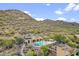 Community pool area surrounded by desert landscape with mountain views at 36600 N Cave Creek Rd # D11, Cave Creek, AZ 85331