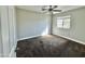 Bright bedroom features a ceiling fan and a window with natural light at 3707 W Carter Rd, Phoenix, AZ 85041