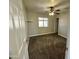 Cozy bedroom boasts neutral walls, ceiling fan, and ample natural light at 3707 W Carter Rd, Phoenix, AZ 85041