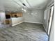 Bright living room featuring tile flooring, modern light fixture, and sliding glass doors at 3707 W Carter Rd, Phoenix, AZ 85041