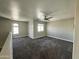 Upstairs living space with carpeting, neutral color palette, and a ceiling fan at 3707 W Carter Rd, Phoenix, AZ 85041