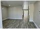 Spacious living room features wood-style floors and neutral color palette at 3707 W Carter Rd, Phoenix, AZ 85041