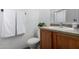 Bathroom featuring a wood vanity, toilet, and decorative hand soap at 3819 E Jasper Dr, Gilbert, AZ 85296