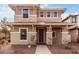 Charming two-story home showcasing neutral tones, a welcoming entryway, and manicured landscaping at 3819 E Jasper Dr, Gilbert, AZ 85296