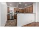 Well-lit kitchen showcasing stainless steel appliances and ample counter space with wood cabinets at 3819 E Jasper Dr, Gilbert, AZ 85296