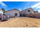 Fenced backyard area with patio at 38226 N Kyle St, San Tan Valley, AZ 85140