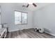 Neutral bedroom with window, blinds, and wood-look floors at 38226 N Kyle St, San Tan Valley, AZ 85140