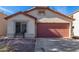 Charming single-story home featuring a terra cotta tiled roof and a spacious two car garage at 38226 N Kyle St, San Tan Valley, AZ 85140