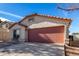 Charming single-story house with a front yard bench and a convenient two-car garage at 38226 N Kyle St, San Tan Valley, AZ 85140