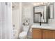 Stylish bathroom featuring a shower-tub combo and a decorative mirror at 3921 E Runaway Bay Pl, Chandler, AZ 85249