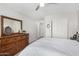 Bedroom boasts a dresser, closet, and neutral tones for a calming atmosphere at 3921 E Runaway Bay Pl, Chandler, AZ 85249