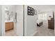 Hallway view into bathroom and bedroom, promoting seamless home living at 3921 E Runaway Bay Pl, Chandler, AZ 85249