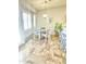 Bright dining area featuring modern lighting and elegant tile flooring at 3921 E Runaway Bay Pl, Chandler, AZ 85249