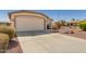 Charming single-story home featuring a two-car garage and low maintenance desert landscaping at 3921 E Runaway Bay Pl, Chandler, AZ 85249